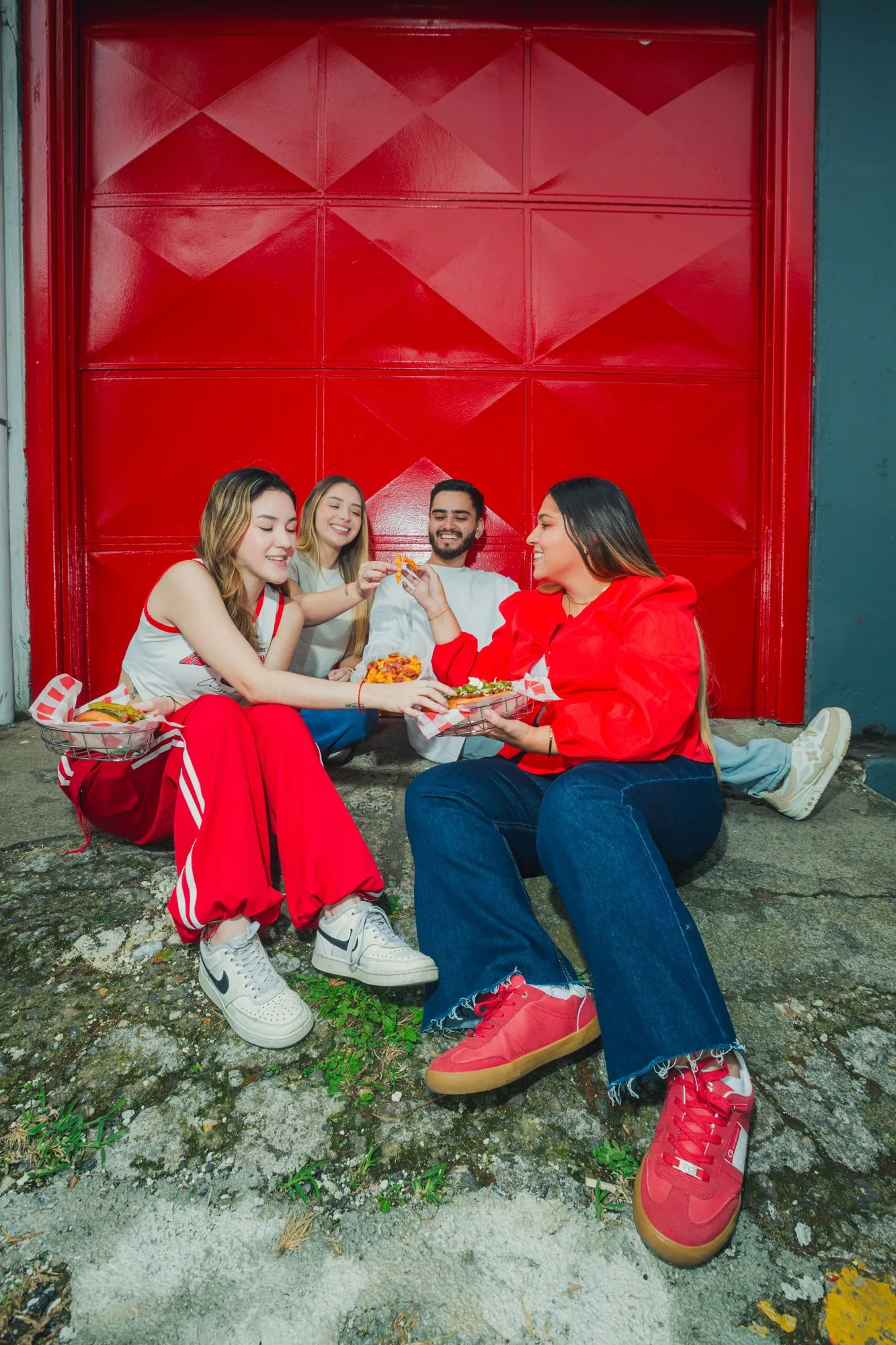 Friends eating hot dogs